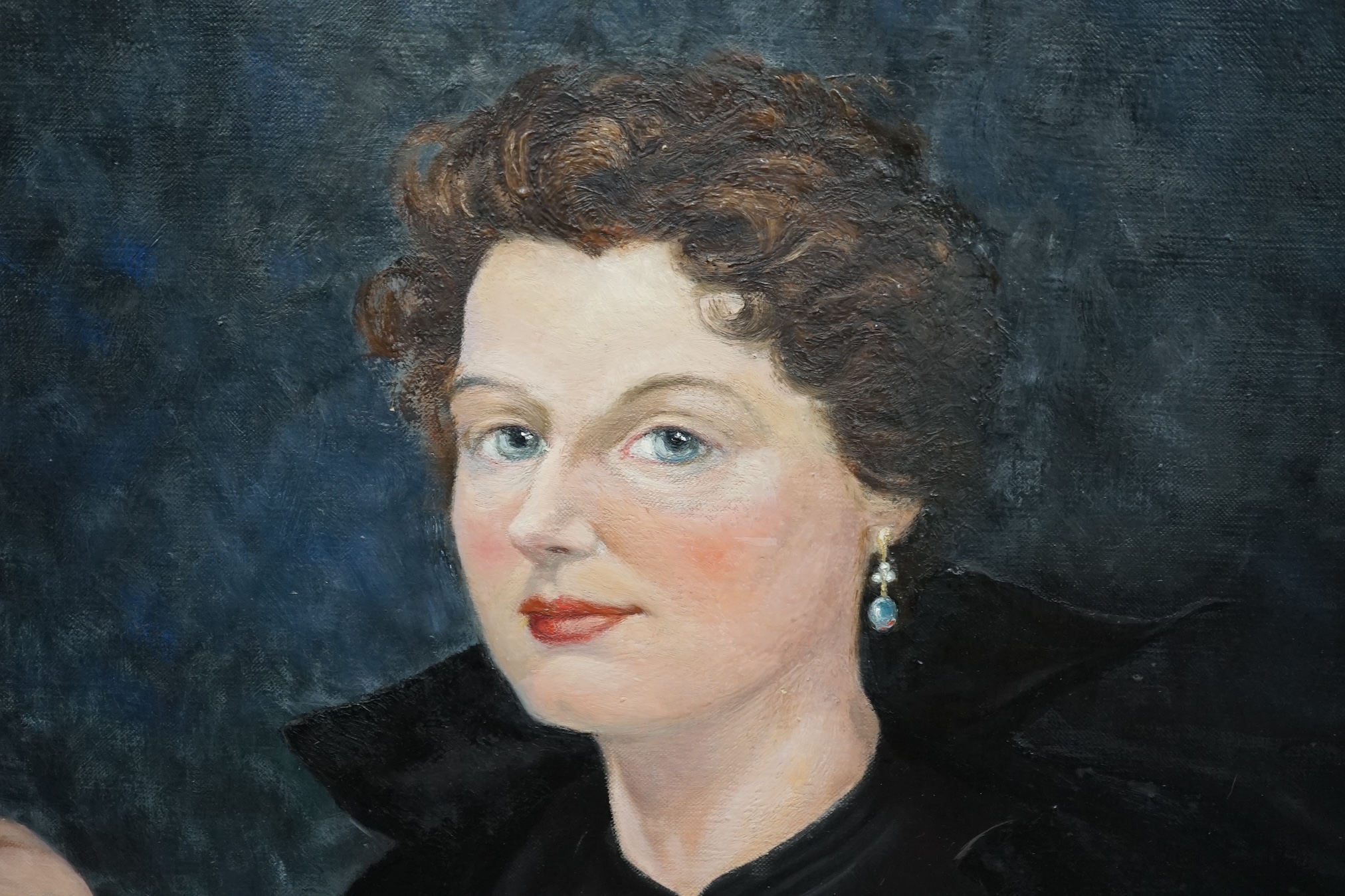20th century oil on canvas, Portrait of a seated woman smoking, unsigned, 91 x 69cm. Condition - fair